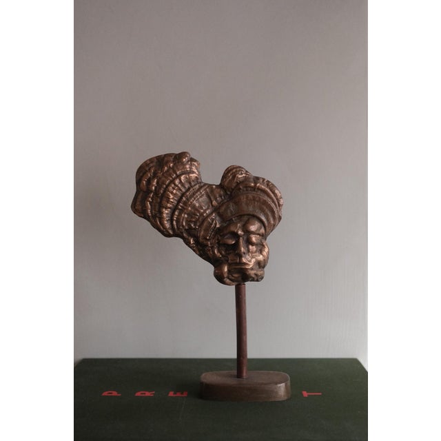 Bronze sculpture by the Belgian painter and sculptor Charles Delporte (1928-2012). A face with closed eyes emerges from a...