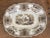 A mid 19th century Staffordshire brown Texian Campaign platter marked JB. The center with soldiers and horses and the...
