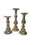 Offering a restored set of three polished brass candlestick holders. Each holder offers a unique central columns that is...