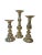 Offering a polished set of three polished brass candlestick holders. Each holder offers a unique central columns that is...