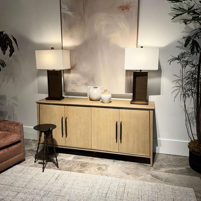 Crafted with a refined tapered silhouette, this sideboard embodies understated elegance and functionality. The oak frame...