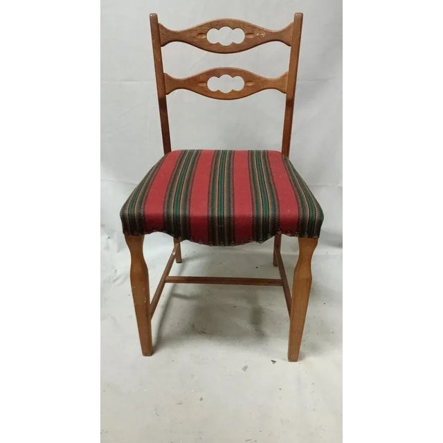 Single dining chair by Henning Kjaernulf in oak I have official proof of authenticity such as vintage catalogs, designer...