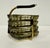MCM 1950s stacking party set ashtrays in smoky gray glass. Includes four hexagonal ashtrays, and one metal carrying stand....