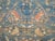 An early 20th century Persian Malayer rug. Abrashed blue field and terracotta border. A few pigeons are spotted in the...