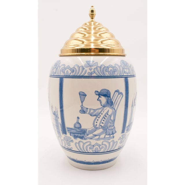 Age: Approx: 30 Years Old Details: Blue & white lidded porcelain jar/urn/vase. Decorated with 3 scenes of figures and...