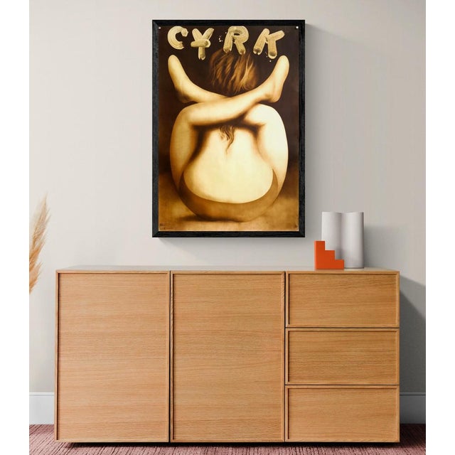 The Piece This striking 1978 poster, designed by Jerzy Czerniawski for the Polish Circus (Cyrk), features a surreal and...