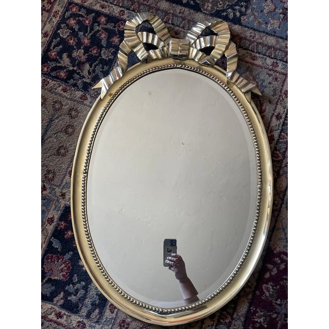 Elevate your space with the Decorative Crafts Brass Gold Frame Bow Mirror, a statement piece that embodies the elegance of...