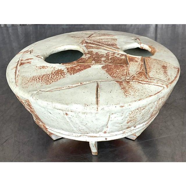 Embrace the eclectic allure of this Vintage Boho Signed Studio Pottery Vase, a quintessentially American masterpiece...