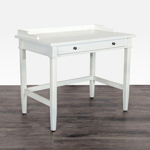 This Crate & Barrel desk features a clean white finish and a simple, modern design. It comes with a spacious tabletop and...