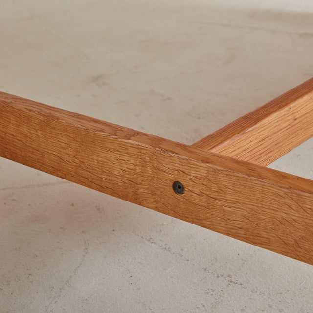 A Mid-Century Modern rectangular oak coffee table created by Danish designer Kurt Østervig in the 1960s. This minimalistic...