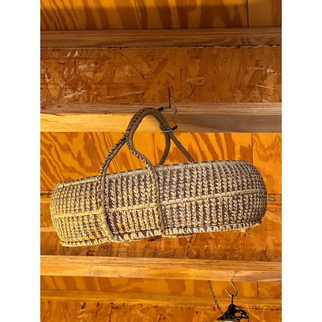 Stunning , beautifully crafted vintage handwoven basket featuring an eye-catching center cross-handle design. Meticulously...