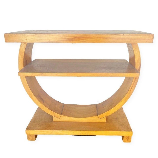 Blond, two-tier Art Deco Pearwood side table designed by Gilbert Rohde for Brown Saltman Furniture company. This fantastic...