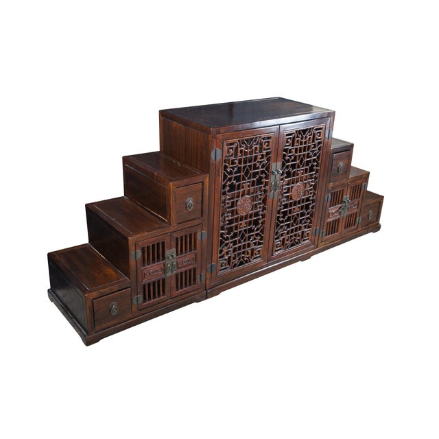 Vintage Ming style Tansu step chest or storage cabinet. Made from beautiful elm with traditional staircase form. The...