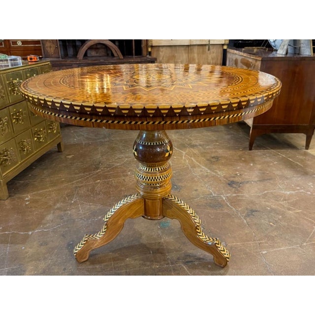 The Mid 20th Century Italian Inlaid Sorrento Table is a luxurious and stylish piece of furniture. The intricate inlaid...
