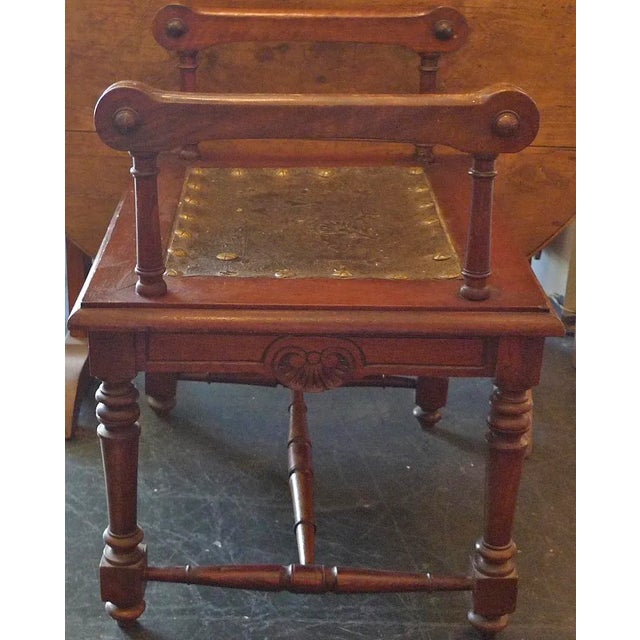 Here we have an usual small 19th century French walnut bench. There is a zinc seat with metal studs and 2 hand crafted...