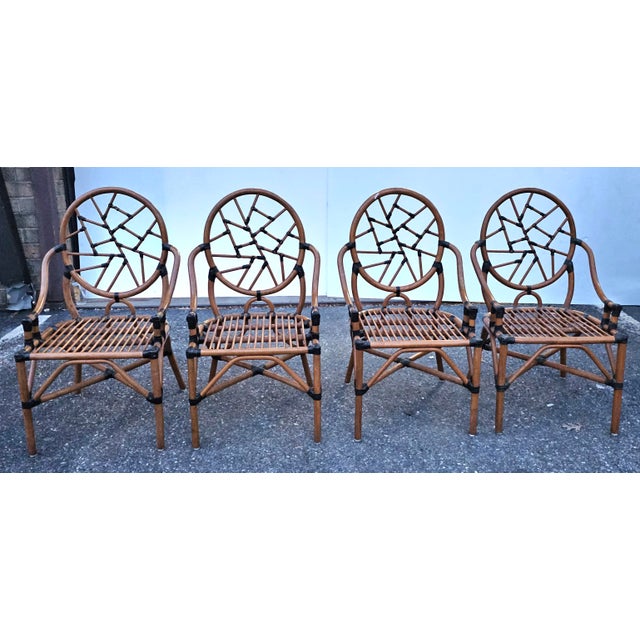 Beautiful Set of Four McGuire Attributed Rattan and leather wraps "Cracked Ice" Dining Chairs. Measures 23" in width, 25"...