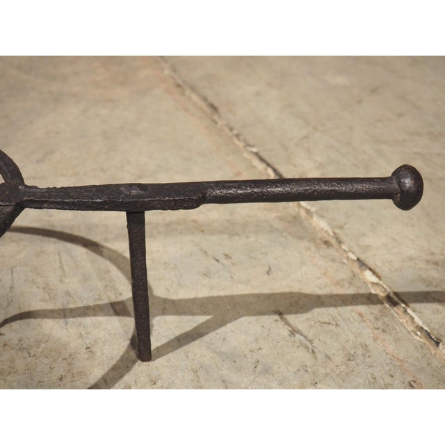 Hand-forged in the 1700s, this iron cooking trivet is sometimes referred to as a fire stand. The circular stand has three...