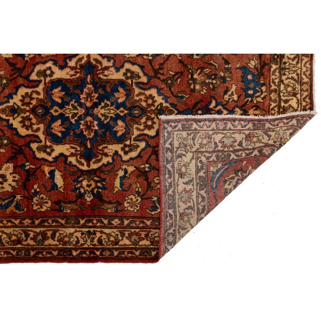 An extraordinary mid-20th century hand-knotted vintage Turkish wool rug featuring a rich, sophisticated palette of warm...
