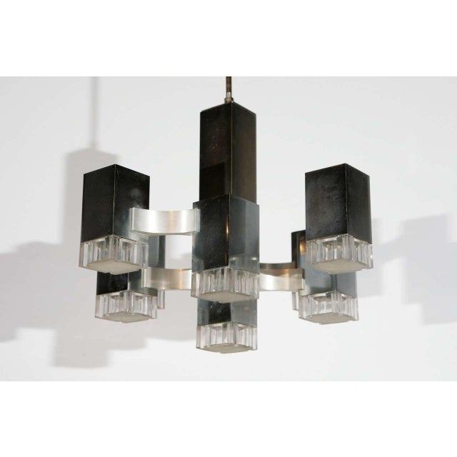 Nine-light nickel and aluminum Sciolari pendant.