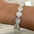 71.45 Carat Round Cabochon Cut Moonstone Tennis Bracelet in sterling silver showcases endlessly sparkling natural...