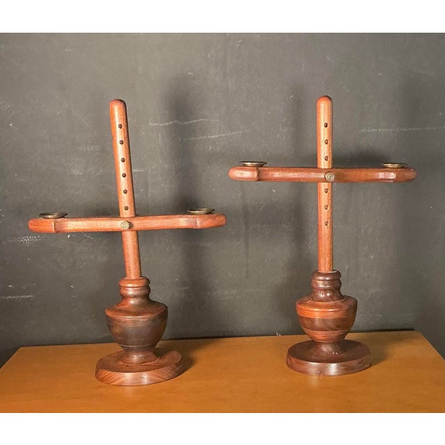 Matching pair of vintage Mid-Century Modern Scandinavian design, adjustable wooden candle holders. These feature a brass...