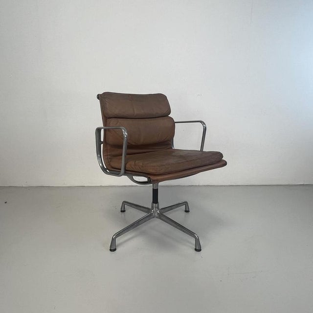 Beautiful vintage tan / camel brown leather Soft Pad Aluminium Group chair designed by Charles and Ray Eames for Herman...