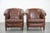 We are offering this unique set of 6 cognac-colored cowhide club chairs in English style with a luxurious look. This...