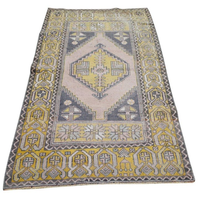 Hand-knotted with care using traditional rug-making techniques, this wool rug blends timeless craftsmanship with a modern...