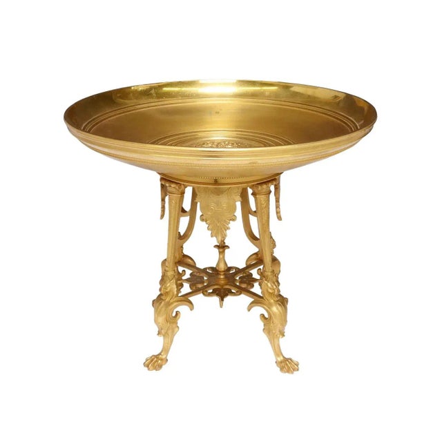 A heavy French greco tazza with griffins and paw feet. Attributed to artist Ferdinand Levillain. Greek writing in center...