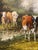 A charming antique oil on board painting depicting three cows in a tranquil pastoral landscape, believed to date from the...