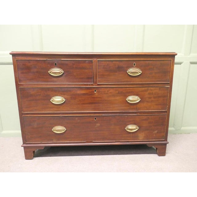 Very Slim Mahogany Chest of Drawers The chest has two short drawers and three graduated long drawers beneath, unusually...
