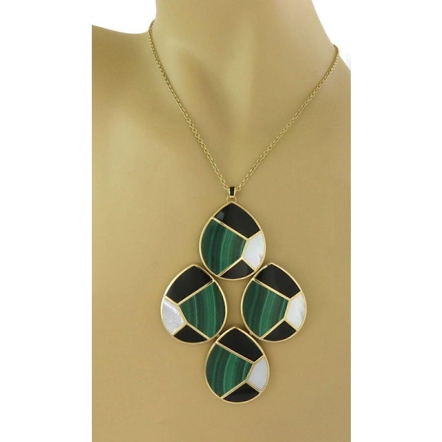 The Ippolita Malachite MOP Onyx 18k Yellow Gold 4 Mosaic Large Pendant Necklace is a stunning piece of fine jewelry....