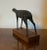 Abstract Mid-Century Modern bronze figure of a standing deer mounted on a wooden plinth. Signed Bradley on the underside...
