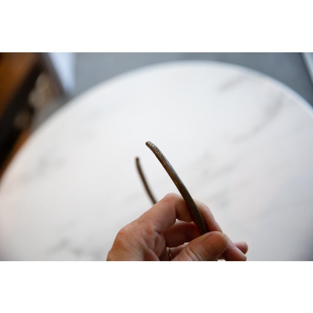 :: Vintage handmade African bronze artifact with geometric detailing. Circa mid 20th century and possibly older, this...