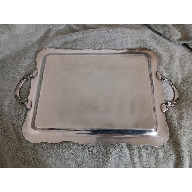 Mid 20th century unmarked silver plate over copper large heavy waiter tray. I love the way the copper is peeking through...