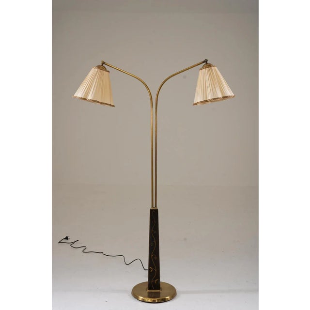 Swedish modern floor lamp by tor wolfenstein for ditzingers, 1940s. This lamp offers two light sources, held by adjustable...