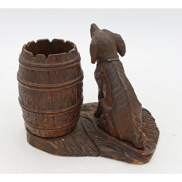 Circa 1880 Black Forest carved Dog Smoker's Table Standish, German. The dog's head lifts to reveal storage for matches,...