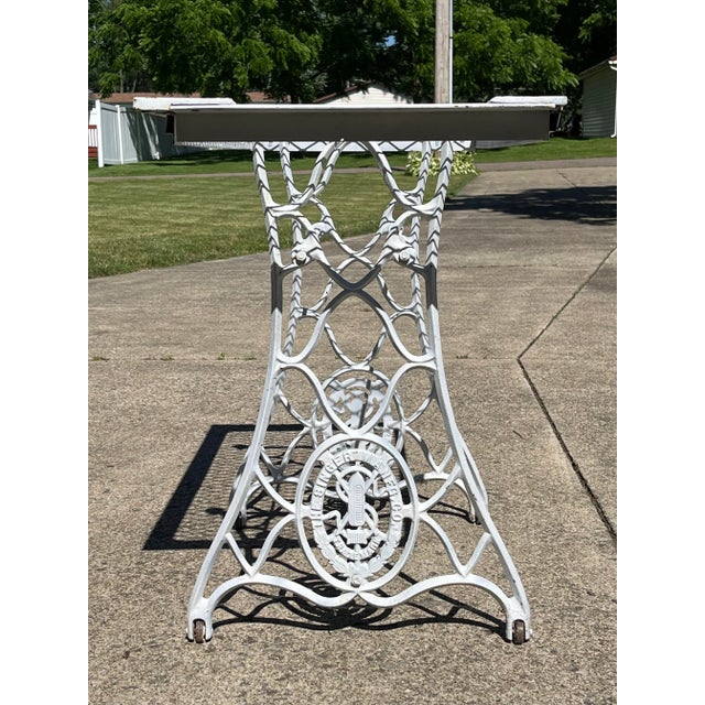 Custom build table of an American System Grate for the table top and a Singer treadle sewing machine base with wheels The...