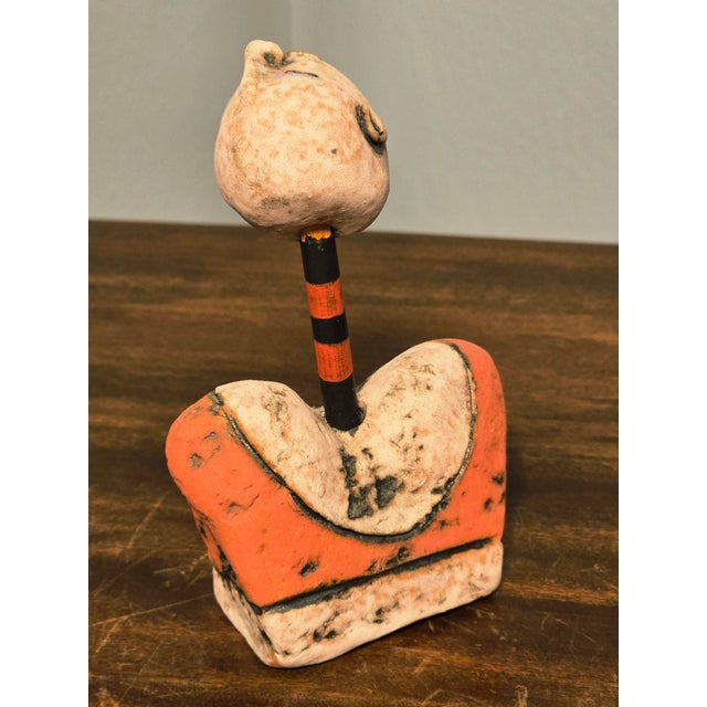 A striking hand‑built ceramic sculpture by contemporary American artist Nancy Kubale, celebrated for her expressive...