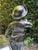 A bronze sculpture with a green patina depicting a young fisherman, signed Hippolyte François Moreau. This naturalistic...