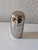 This is a mid-century German metal owl-shaped holder for nested shot glasses. It is made of metal, often stainless steel...