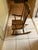 This vintage 1940s-1960s Oak Hill Furniture Company of Fitchburg, MA child's solid wood rocking chair with a German-made...