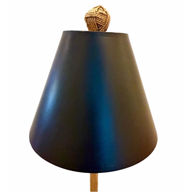 Elegant Italian gold leaf tassel lamp with a gold leaf tassel finial and black lamp shade. Lamp is in excellent condition...