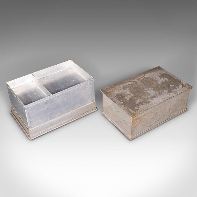 This is a vintage hotel tea chest. A Chinese, pewtered alloy chá caddy, dating to the Art Deco period, circa 1930....