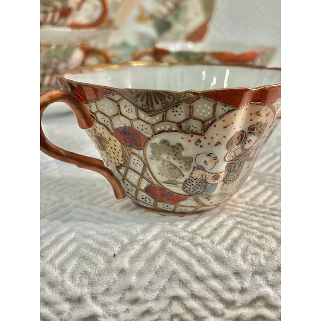Early 20th Century Japanese Kutani Hand Painted Eggshell Porcelain Cup and Saucers With 9” Serving Plate - 9 Pieces For Sale - Image 4 of 7
