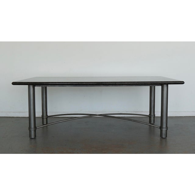 This vintage marble-top table dates to the late 20th century and has a distinctly architectural presence that feels both...