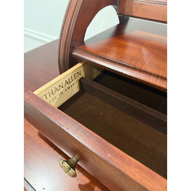 Ethan Allen British Classic Dresser With Mirror. The dresser is crafted from maple with natural characteristics including...