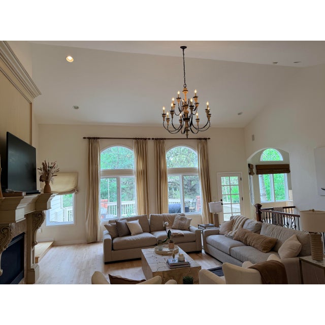 Make a grand architectural statement with this impressive Spanish Revival-inspired chandelier, crafted from sculptural...