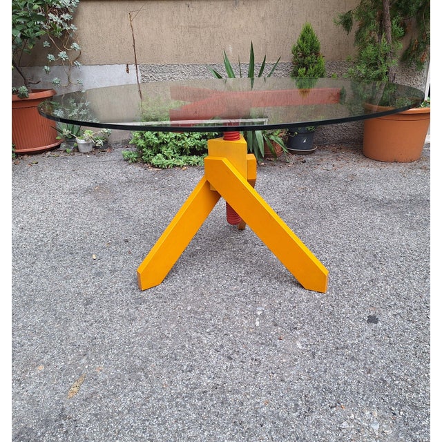 Vidun Dining Table with Round Glass Top and Red and Yellow Beech Legs by Vico Magistretti for De Padova, 1980s For Sale - Image 12 of 12
