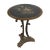This is an English Victorian circular side table with the original painted slate top and and cast iron base. The triform...